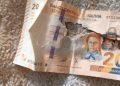 Billete robado del accidente aéreo llega a comerciante en La Paz
